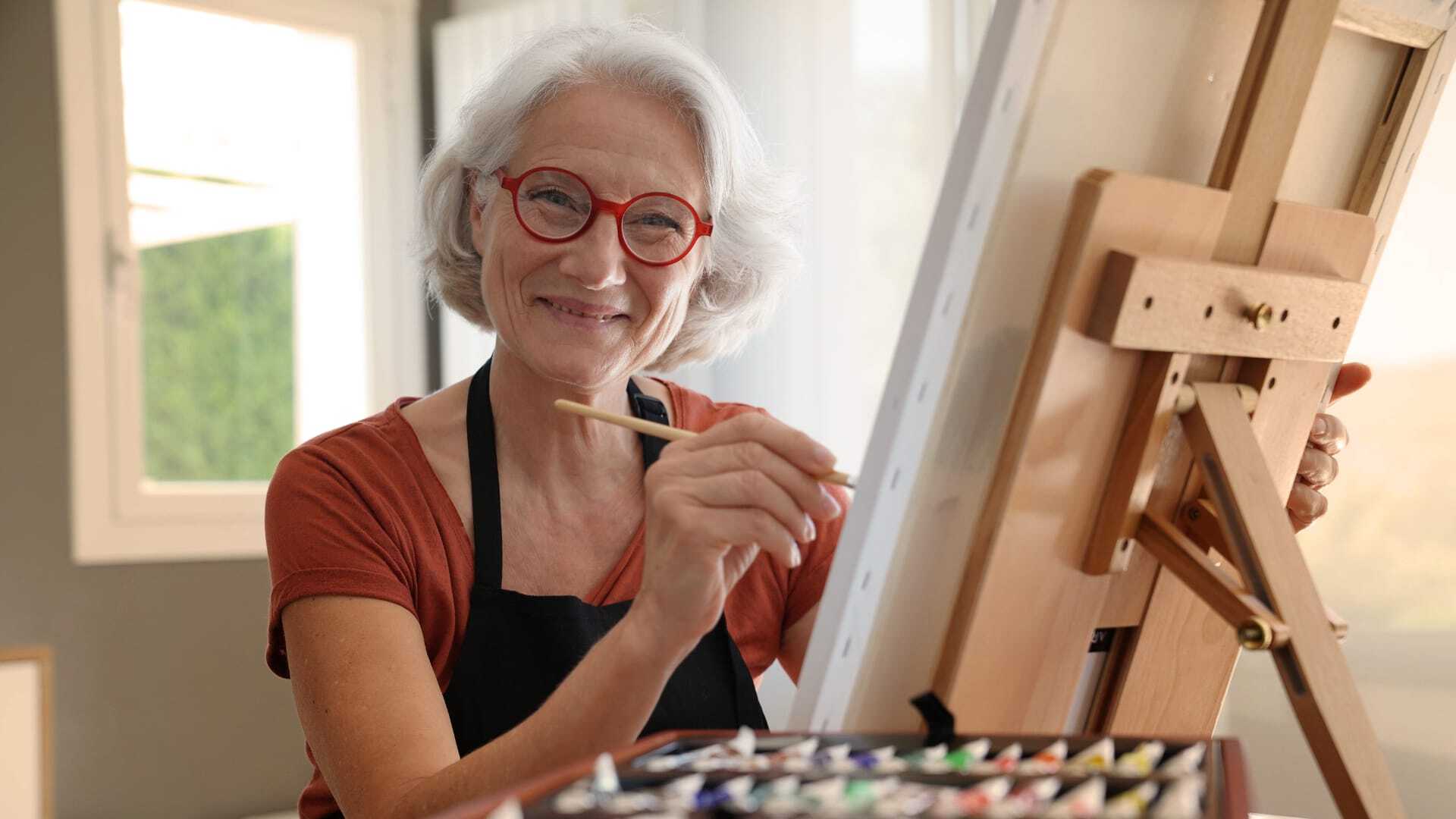 Senior woman painting
